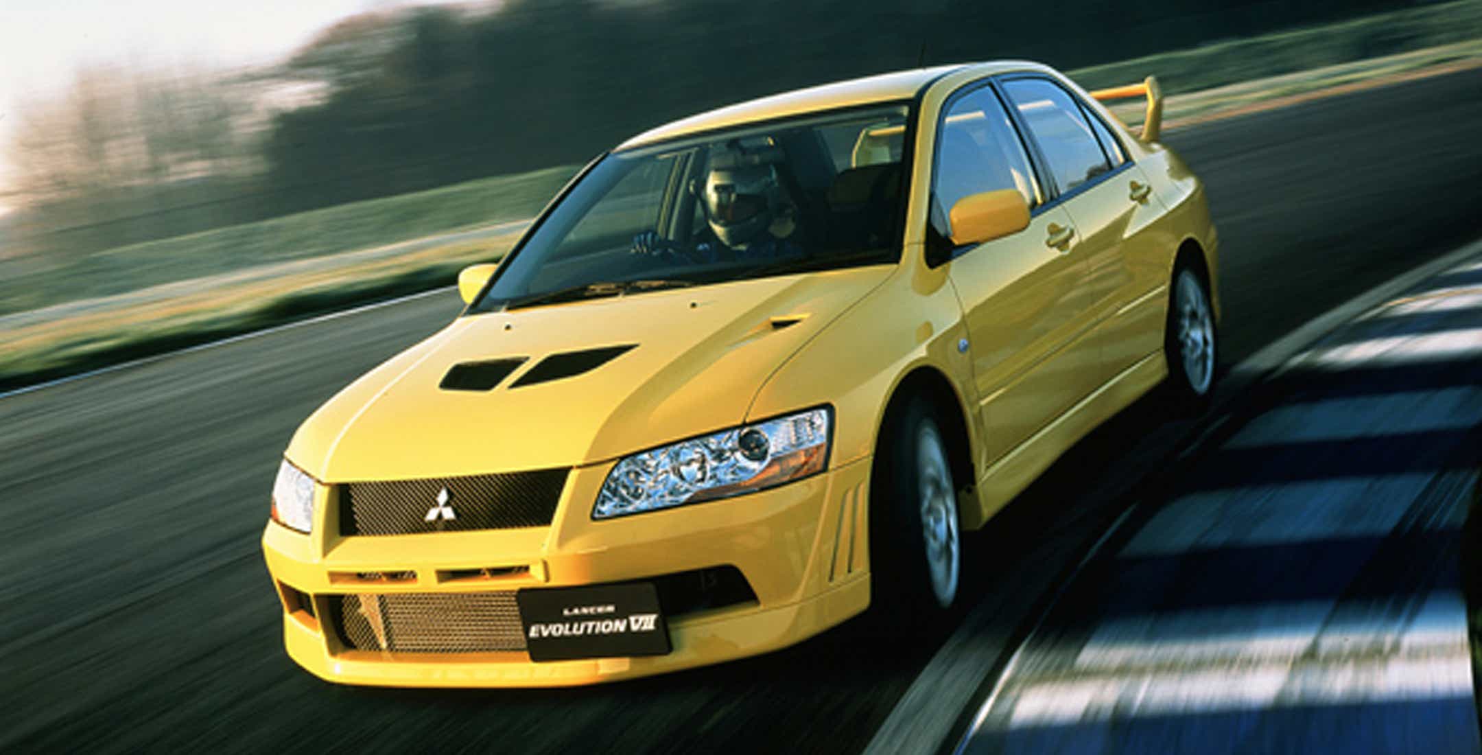 Vintage 2002 New-Ray 1:32 Mitsubishi Lancer Evolution VII Yellow